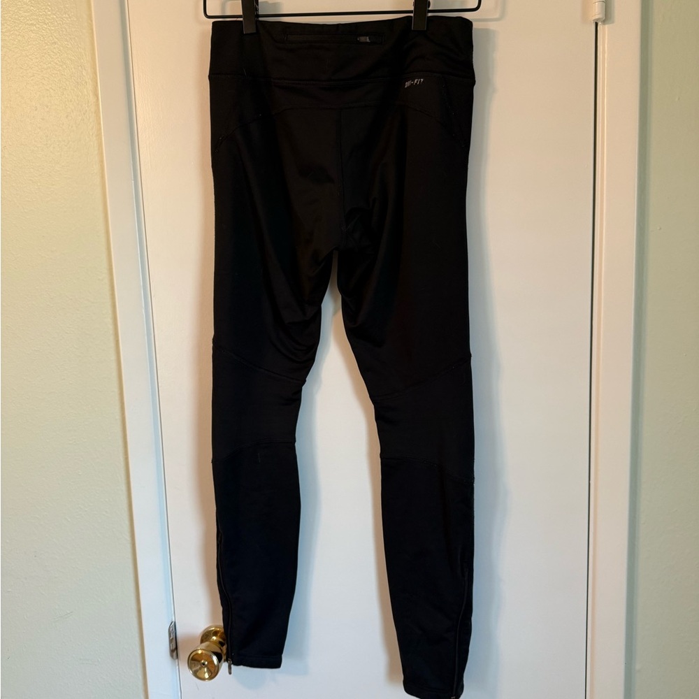 Nike Fleece-Lined Running Tights with drawstring and ankle zippers